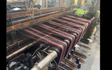 A historic loom weaves tartan at the only tartan mill in the Highlands. Travelers visit the Prickly Thistle as a "Make Travel Matter" experience.