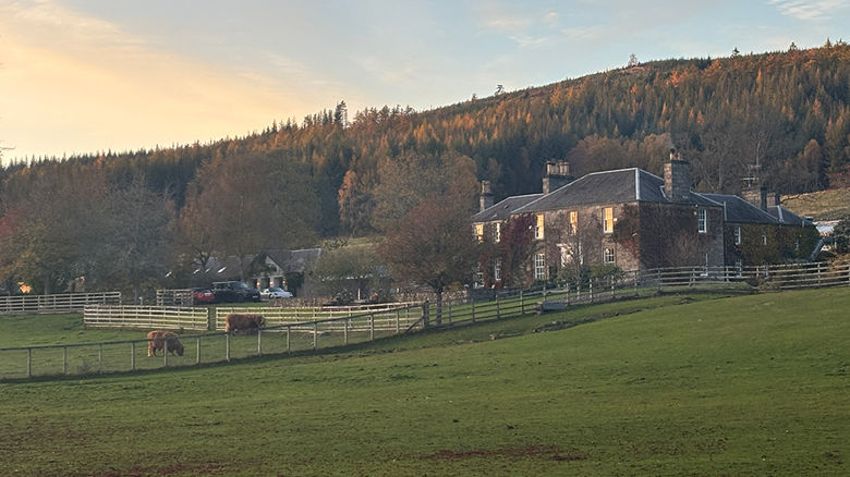The sun sets over The Old Manse of Blair, a boutique hotel in the Scottish Highlands.